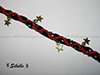 Bracelet bronze multiple étoiles noir et rouge