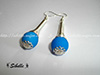 Boucles d'oreilles tourbillon perle bleue